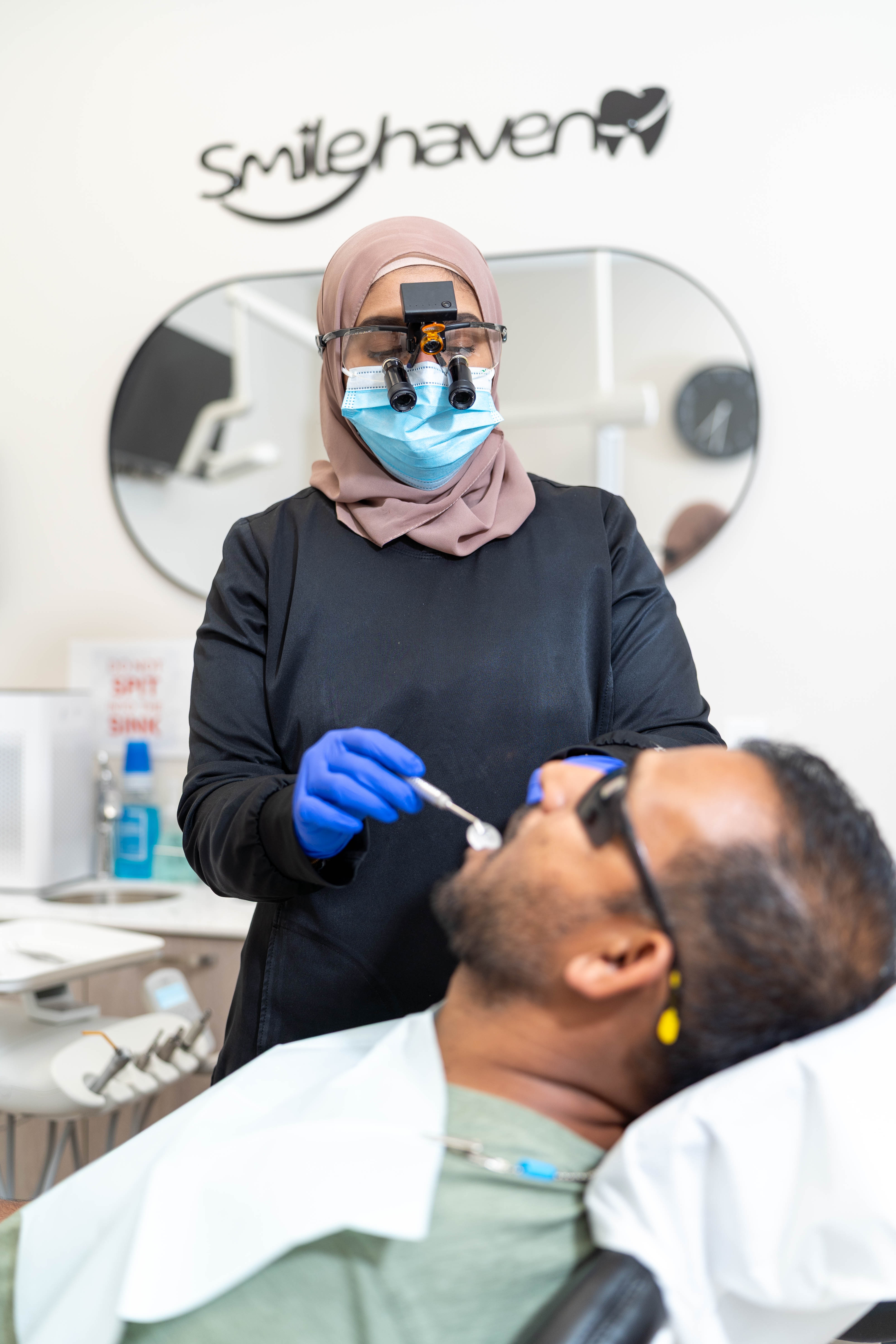 Dr. Faiza caring for a patient during treatment